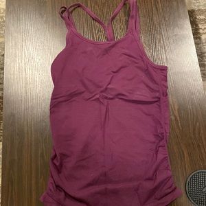 Fabletics built in bra tank. Size L. Has one bleach stain on back